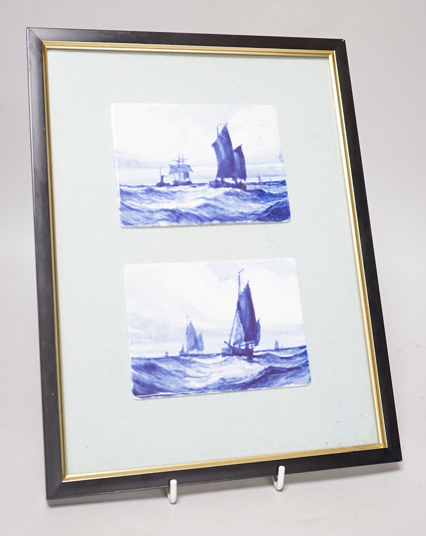 Pair of late 19th /early 20th century Royal Crown Derby framed plaques, hand painted with sailing scenes in blue by WEJ Dean, details and label verso, each mounted, framed and glazed as one, overall 31cm x 24cm